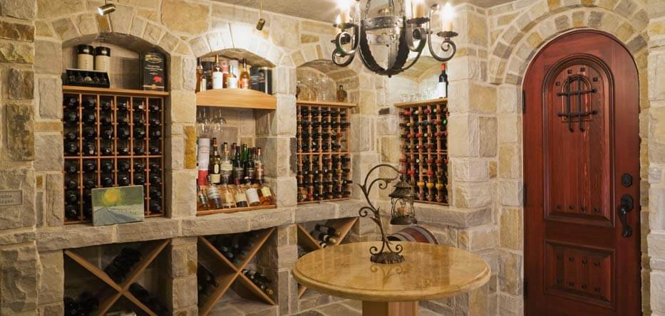 Photograph of a wine cellar with stone walls